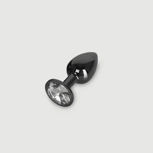 Anal Collection: kleine metalen buttplug met rond sieraad - zwart/transparant