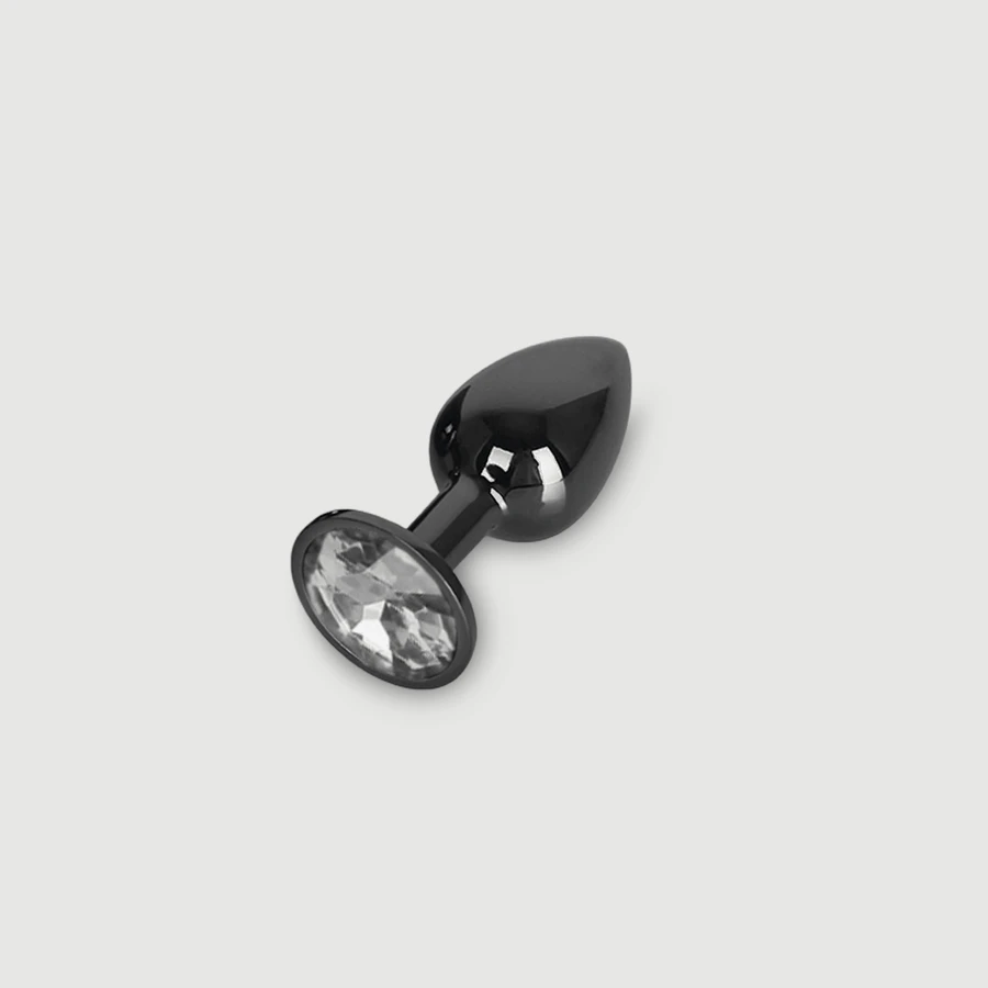Anal Collection: kleine metalen buttplug met rond sieraad - zwart/transparant