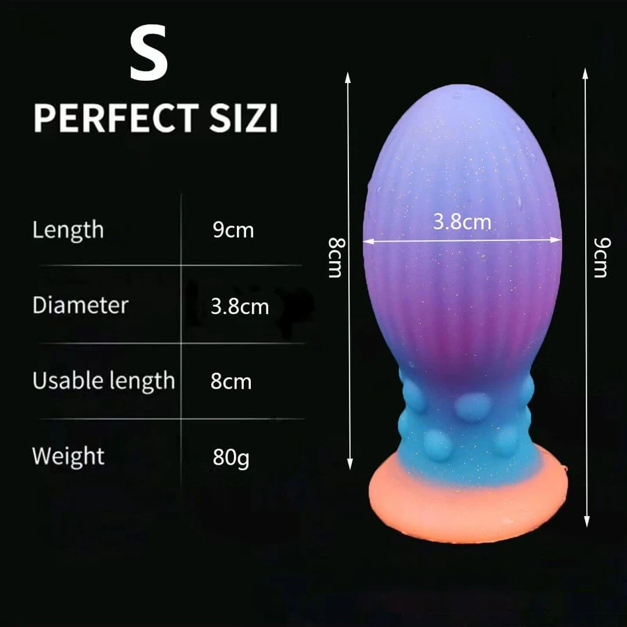 Kleine siliconen eivormige buttplug die in het donker oplicht, met zuignap, 9 x 3,8 cm - veelkleurig